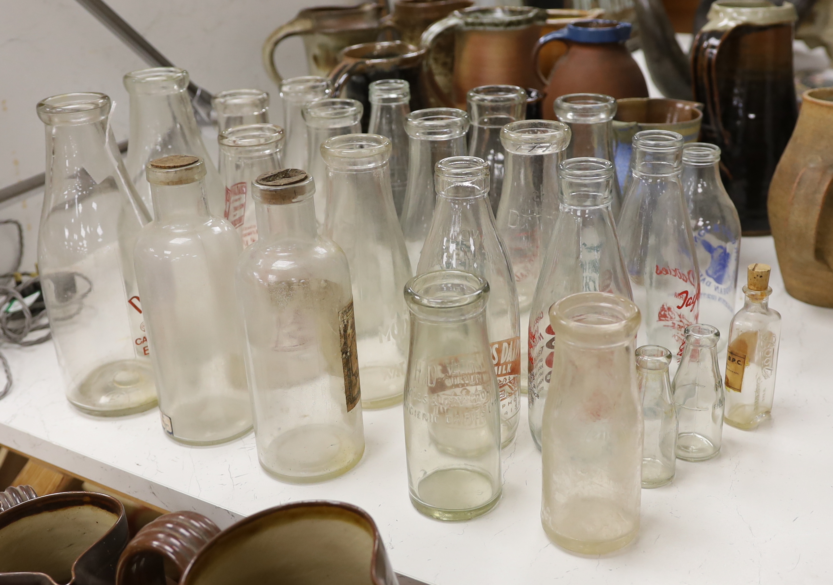 A quantity of vintage glass milk bottles, etc. (23)